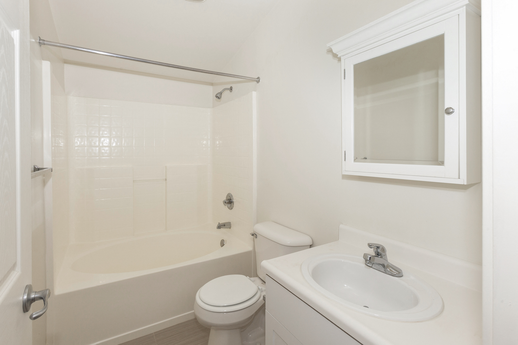 Polo Villas Loft Bathroom with full tub surround and white cabinets  at Polo Villas, Bakersfield, CA